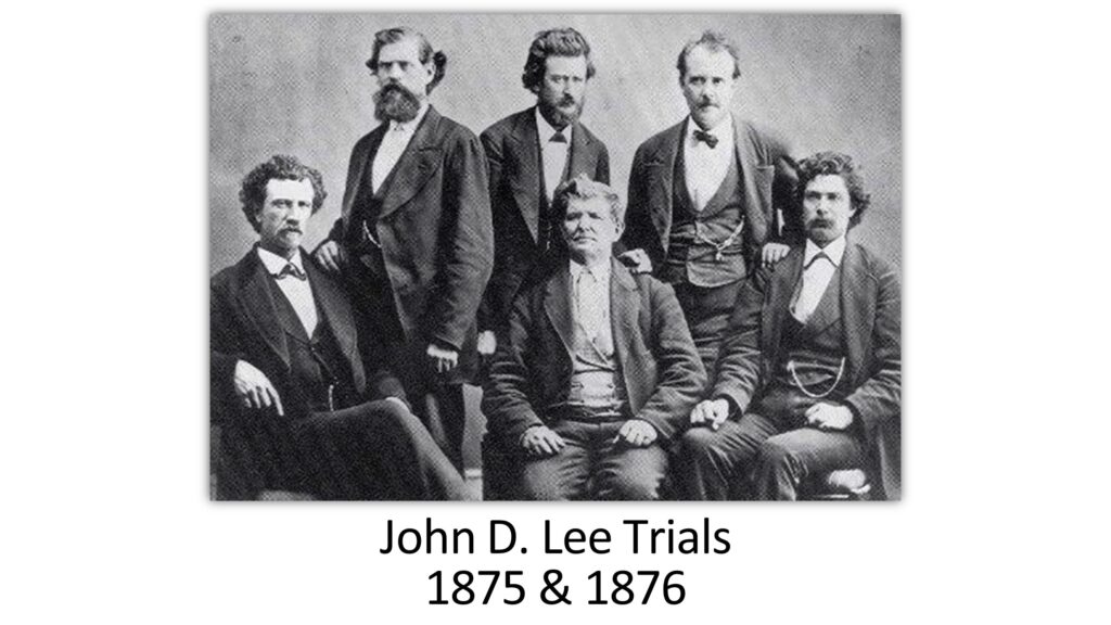 An historic photo with John D. Lee at the center, titled John D. Lee Trials